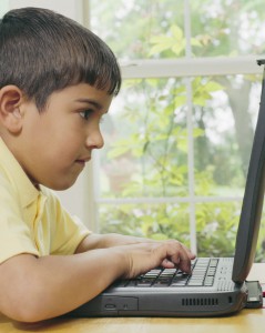 Boy Typing on Laptop